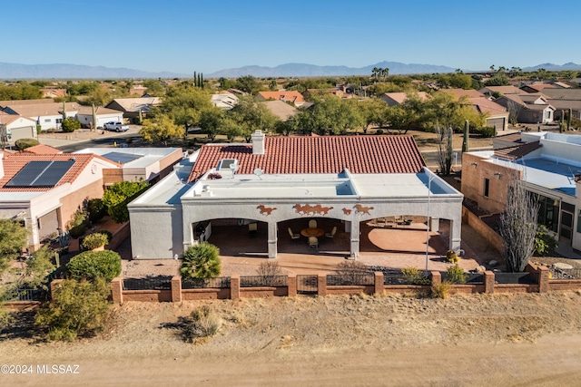 birds eye view of property featuring a mountain view