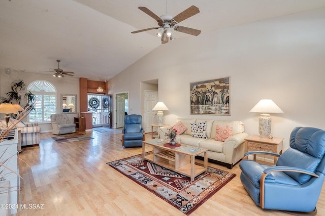 living room with ceiling fan, high vaulted ceiling, and light hardwood / wood-style floors