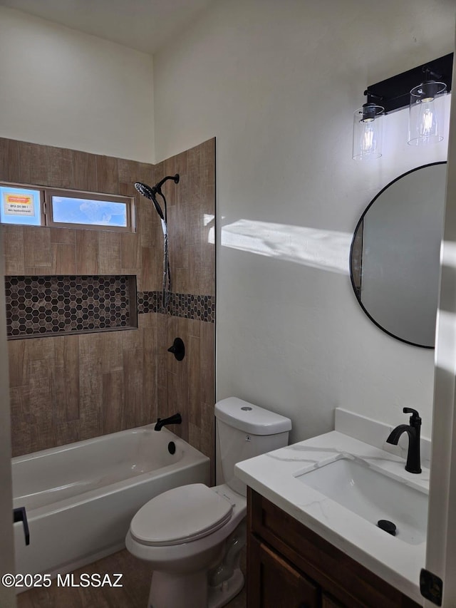 full bath featuring shower / washtub combination, vanity, and toilet