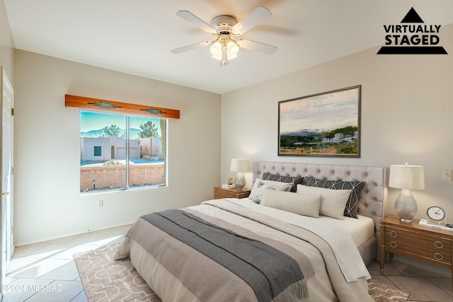 bedroom featuring ceiling fan and light tile patterned floors