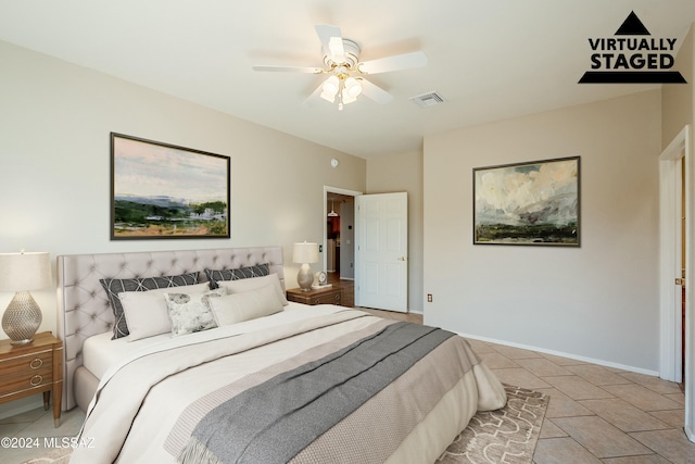 bedroom featuring ceiling fan and light tile patterned flooring