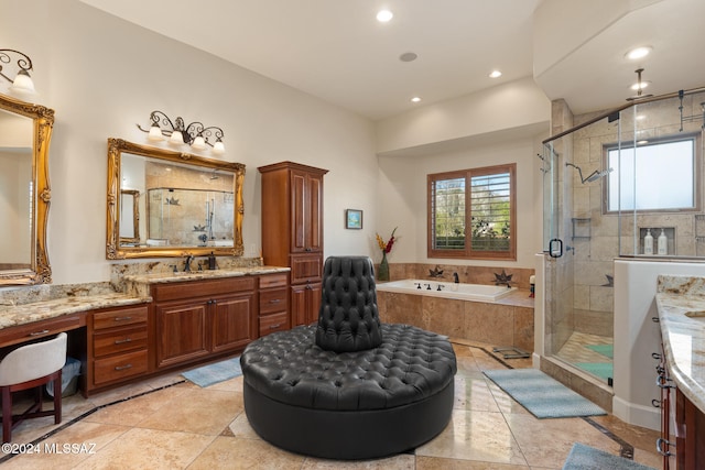 bathroom with tile patterned flooring, vanity, and separate shower and tub