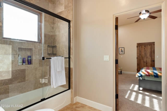 bathroom featuring ceiling fan and enclosed tub / shower combo