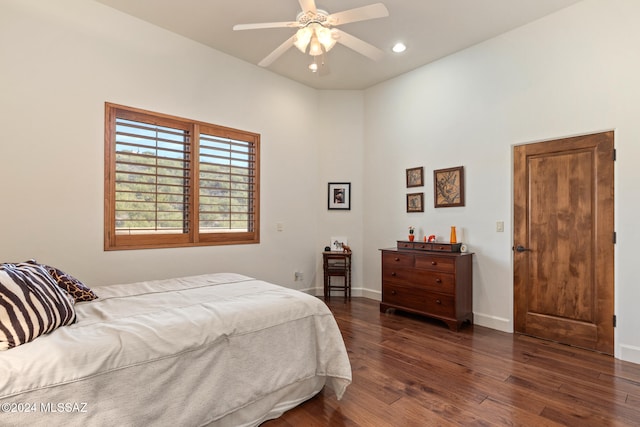 bedroom featuring ceiling fan and dark hardwood / wood-style floors