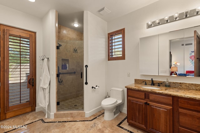 bathroom with tile patterned flooring, vanity, toilet, and an enclosed shower