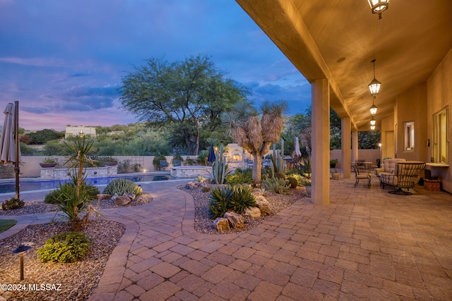 patio terrace at dusk with outdoor lounge area