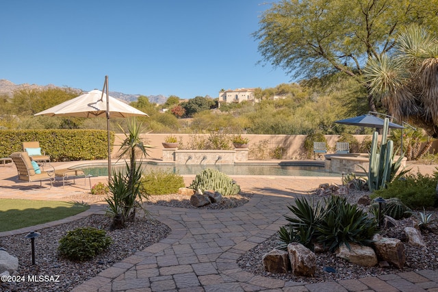 view of patio / terrace featuring a fenced in pool