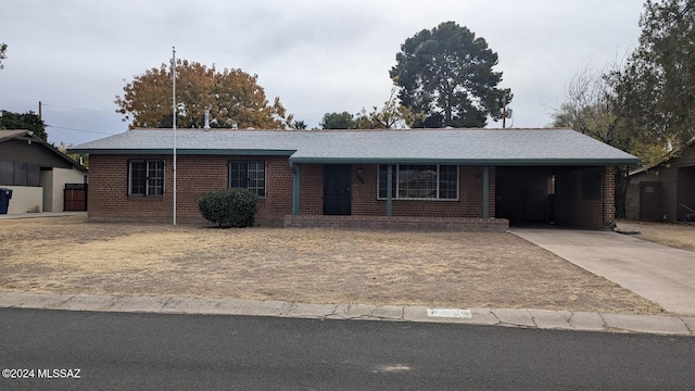 single story home with a carport