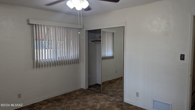 spare room with carpet flooring and ceiling fan