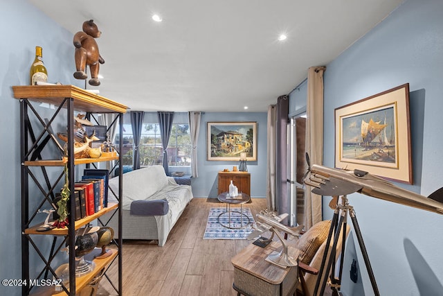 living area with light hardwood / wood-style flooring