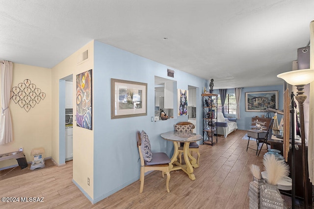 dining area featuring light wood-type flooring