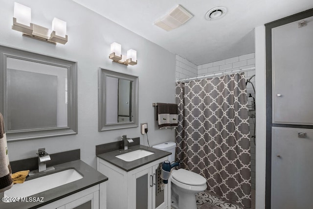 bathroom featuring vanity, curtained shower, and toilet