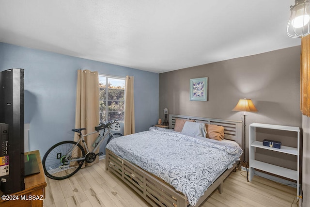 bedroom with light hardwood / wood-style flooring