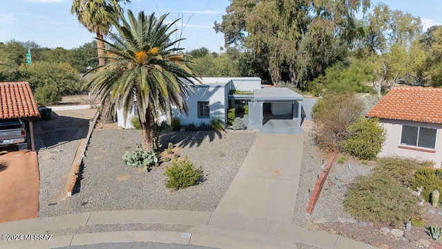 view of front of property with a carport