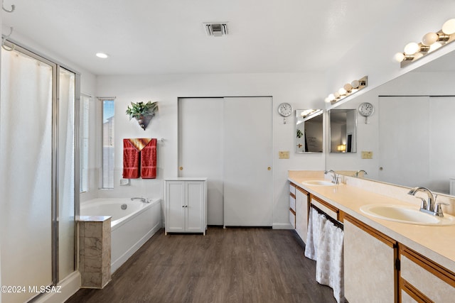 bathroom featuring separate shower and tub, vanity, and hardwood / wood-style flooring