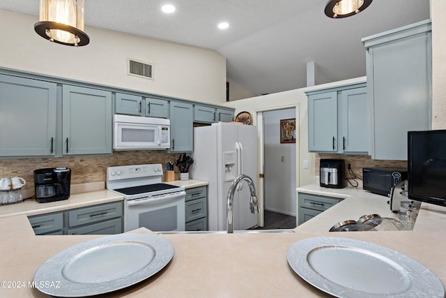 kitchen featuring a textured ceiling, white appliances, backsplash, and vaulted ceiling