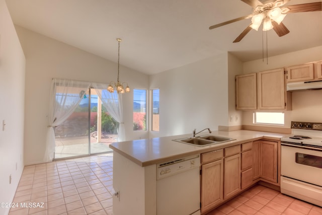 kitchen featuring pendant lighting, lofted ceiling, white appliances, sink, and light tile patterned floors