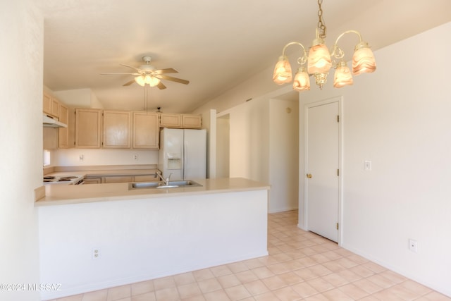 kitchen with white appliances, lofted ceiling, ceiling fan with notable chandelier, sink, and hanging light fixtures