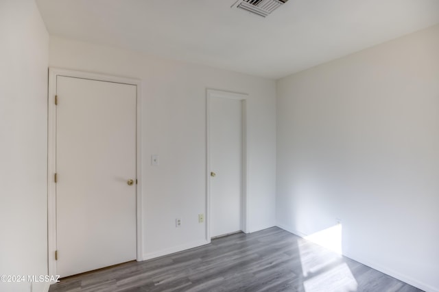 unfurnished bedroom featuring wood-type flooring