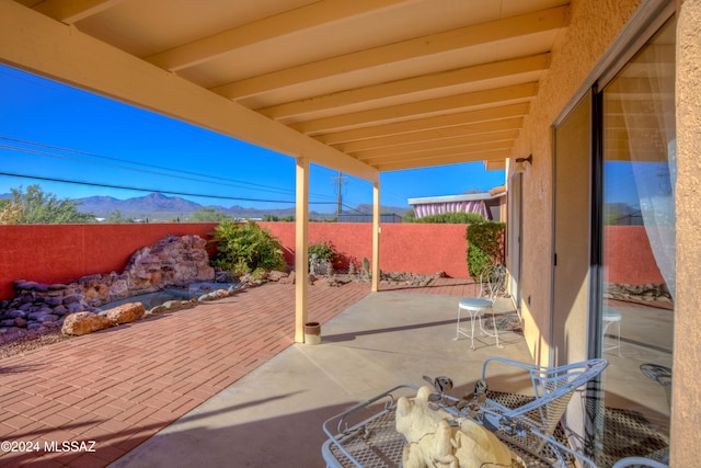 view of patio / terrace featuring a mountain view