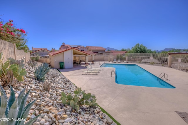 view of swimming pool featuring a patio