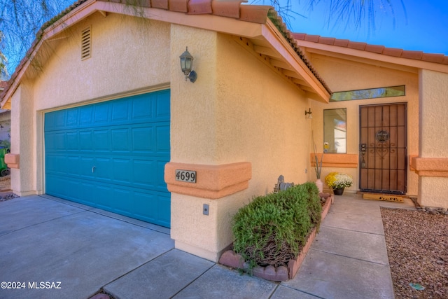 property entrance with a garage