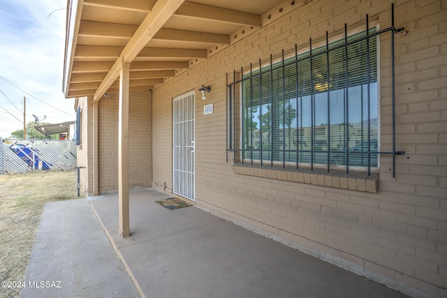 property entrance with a patio