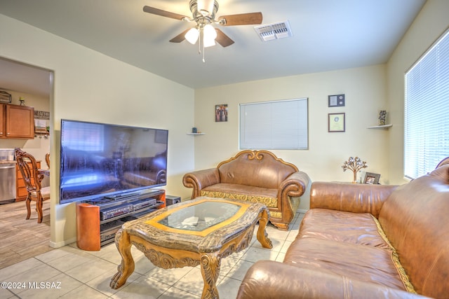 living room featuring ceiling fan and light tile patterned flooring