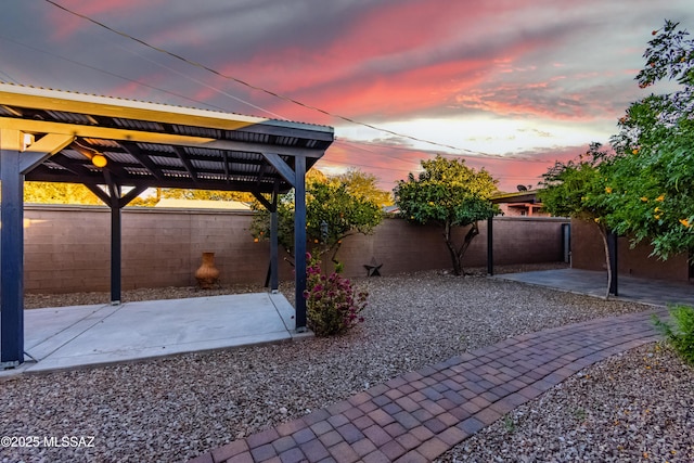 view of patio terrace at dusk