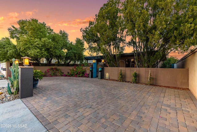 view of patio terrace at dusk