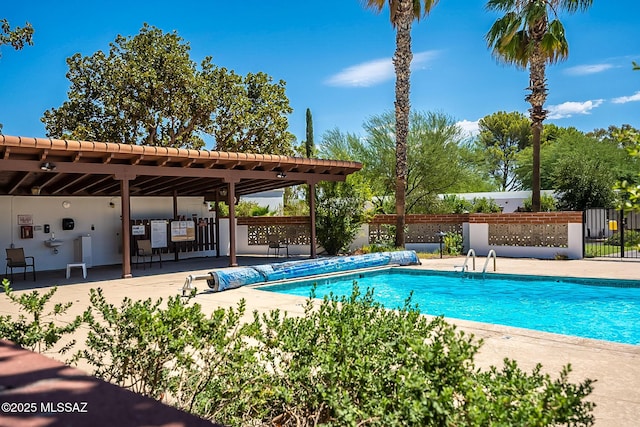 view of swimming pool featuring a patio area