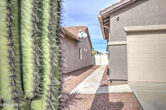 view of side of property featuring a garage