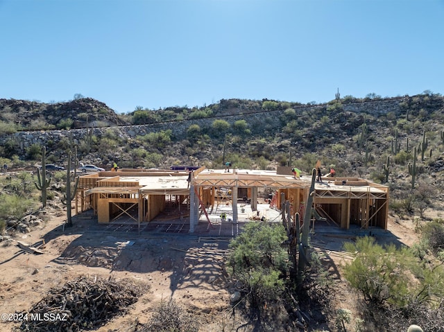 rear view of house with a mountain view