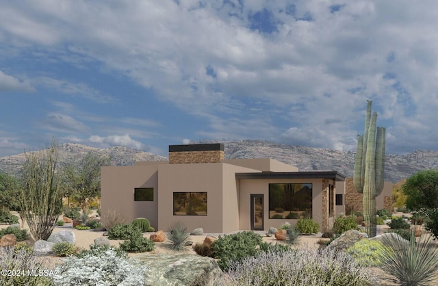 rear view of house featuring a mountain view