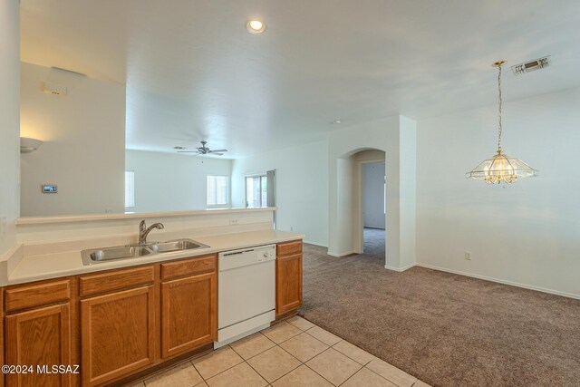 unfurnished living room featuring carpet and ceiling fan