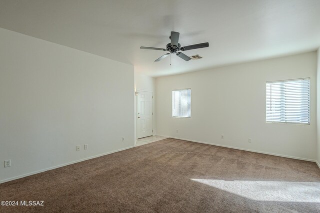 carpeted empty room with ceiling fan