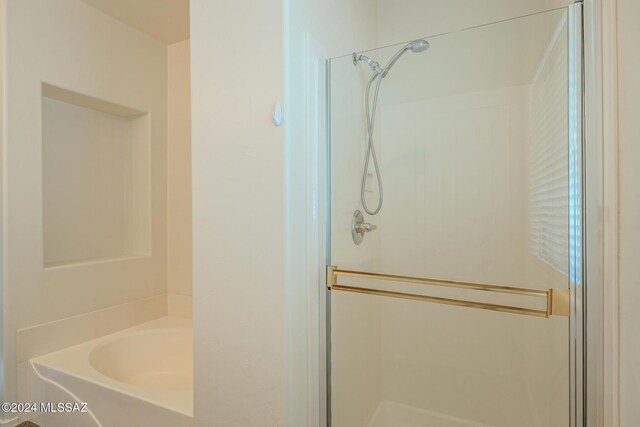 bathroom with a tub to relax in