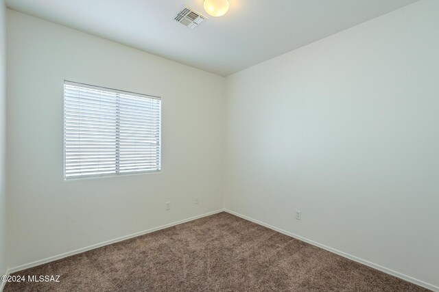 unfurnished bedroom with carpet flooring and a closet