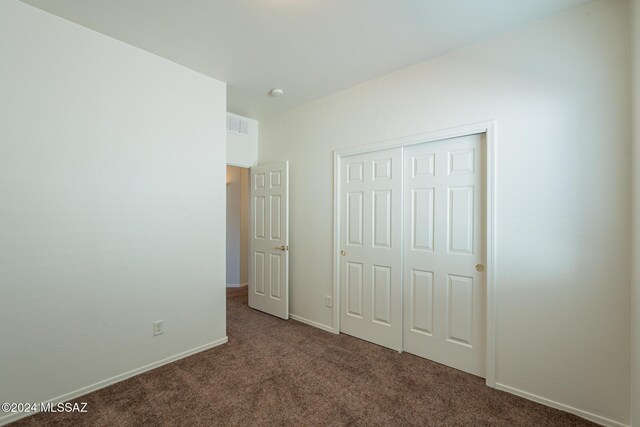 carpeted spare room with a healthy amount of sunlight