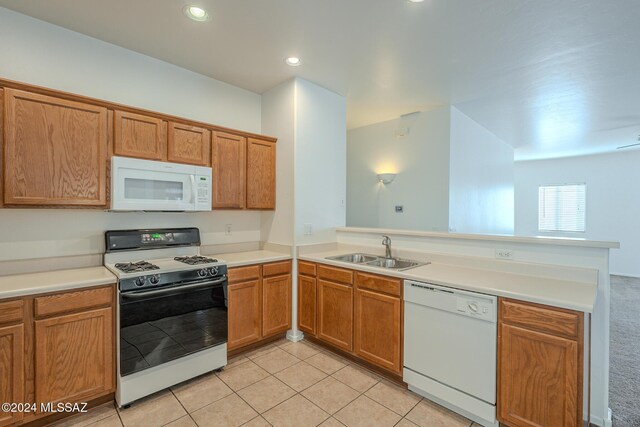 kitchen featuring light tile patterned floors and white appliances