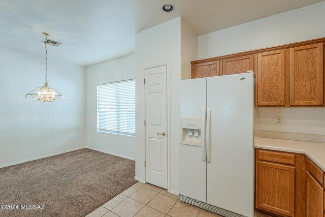 kitchen with pendant lighting, dishwasher, ceiling fan with notable chandelier, sink, and light colored carpet