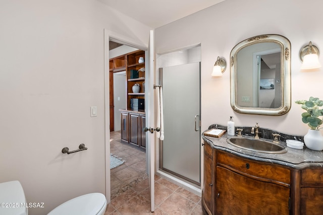 full bathroom with tile patterned flooring, a shower stall, toilet, and vanity