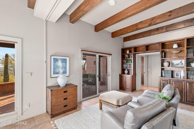 living area featuring light tile patterned flooring and beam ceiling