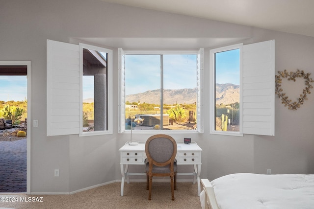 bedroom featuring carpet flooring, lofted ceiling, and a mountain view