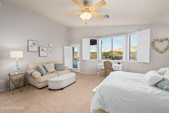 carpeted bedroom with ceiling fan, access to exterior, and vaulted ceiling