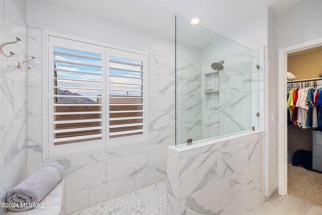 bathroom with tiled shower