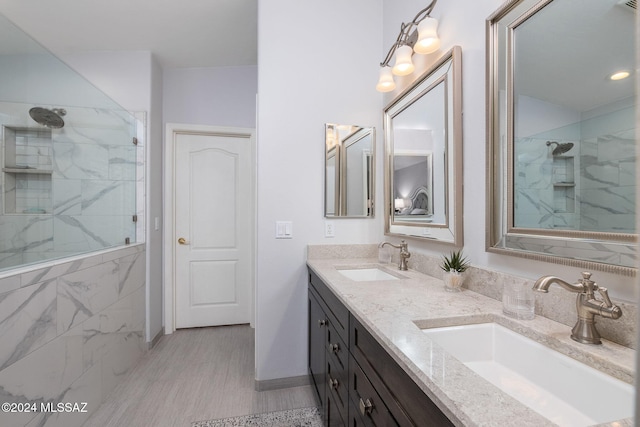 bathroom featuring vanity and a tile shower