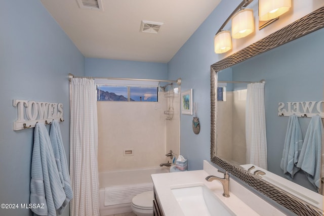 full bathroom with toilet, shower / tub combo, and vanity