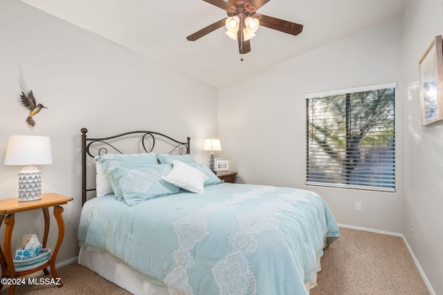 bedroom with ceiling fan, lofted ceiling, and light colored carpet