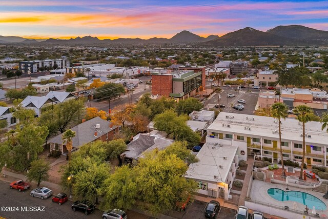 aerial view at dusk featuring a mountain view